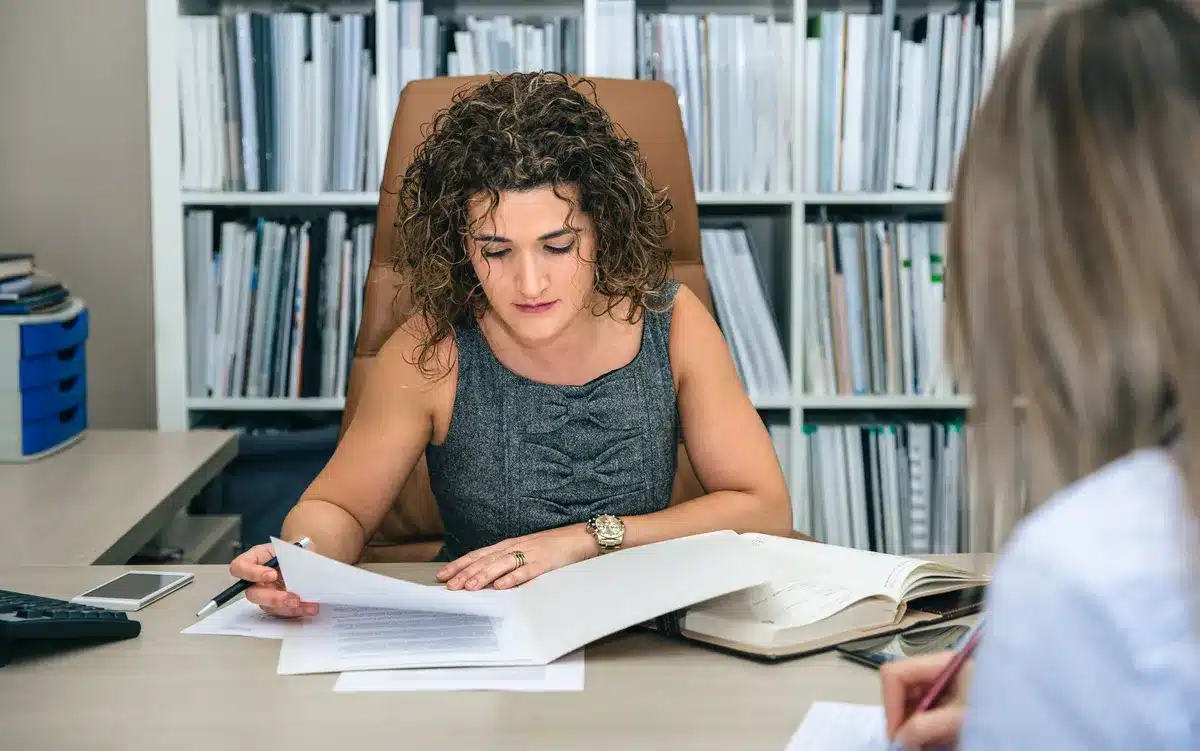 Image of a notary public assessing documents including a council tax bill and bank statement