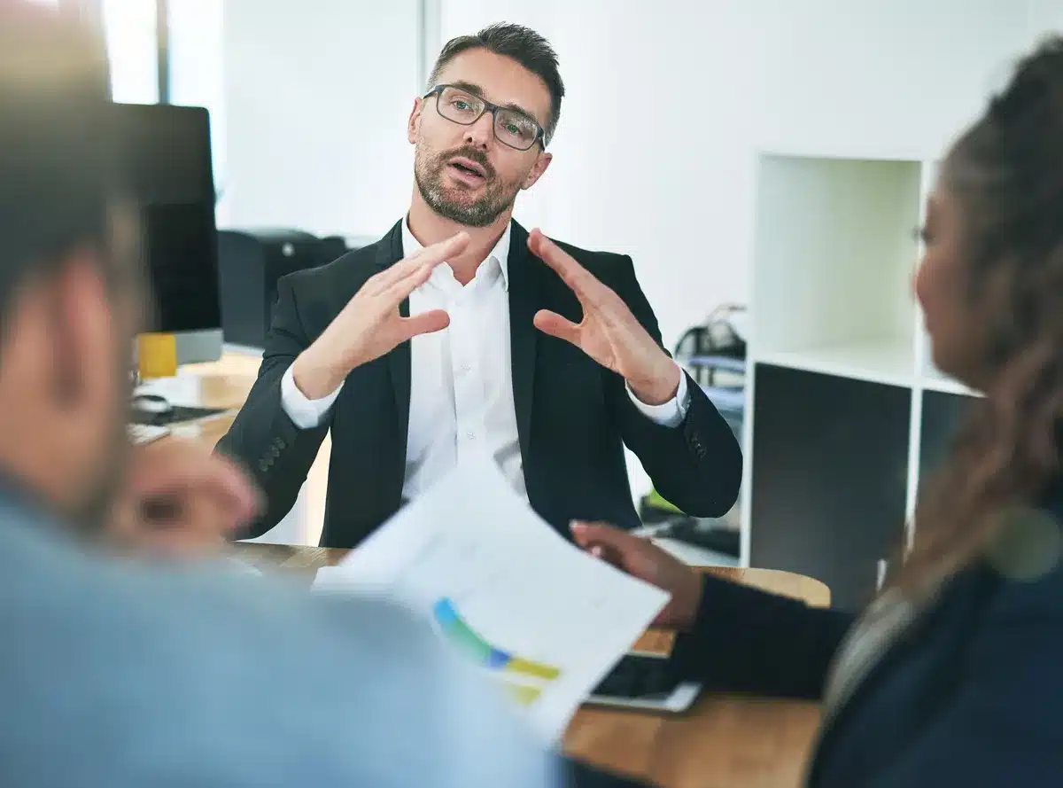 Image of a financial adviser explaining complicated rules to clients
