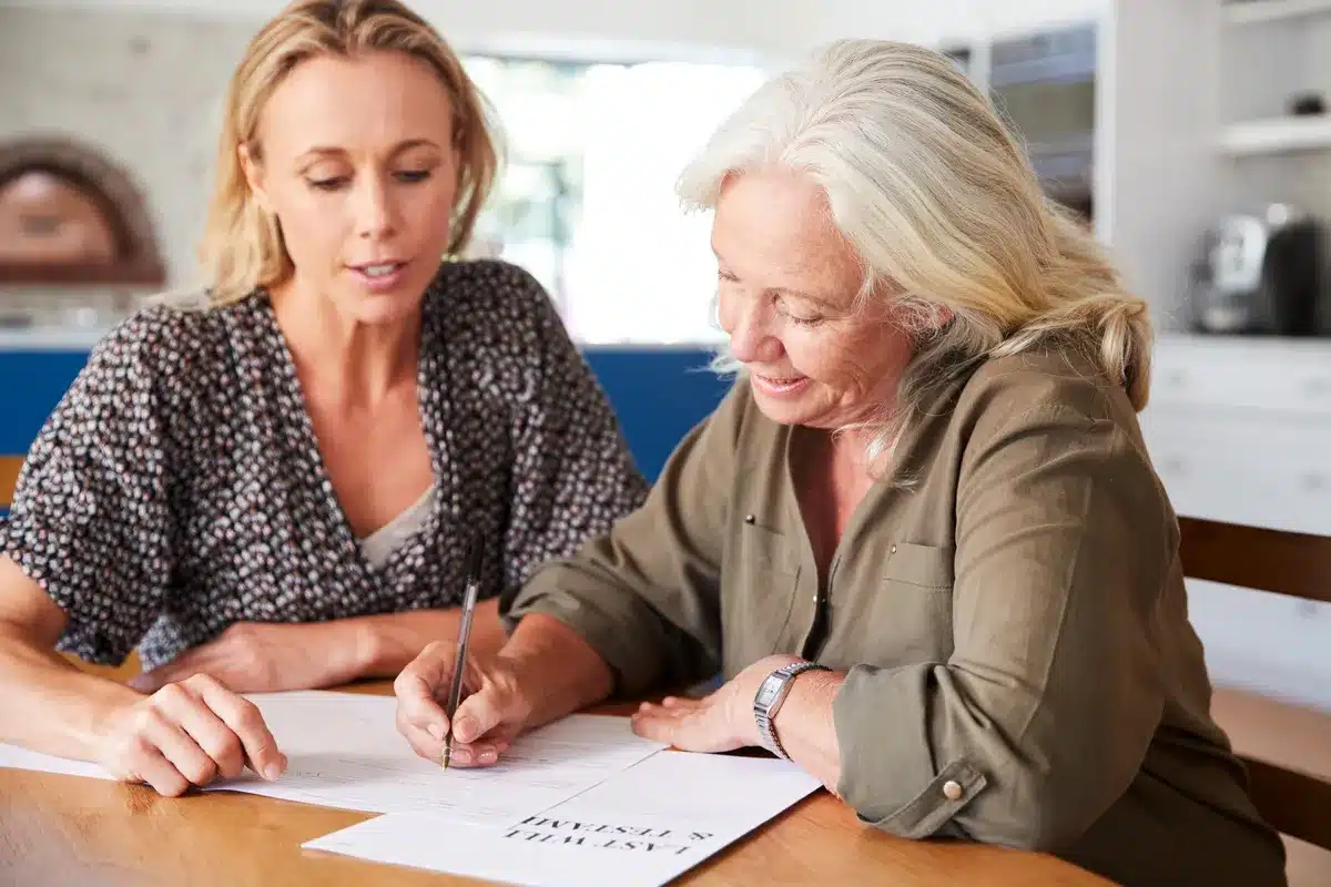 Image of adult children filling in forms for inheritance tax
